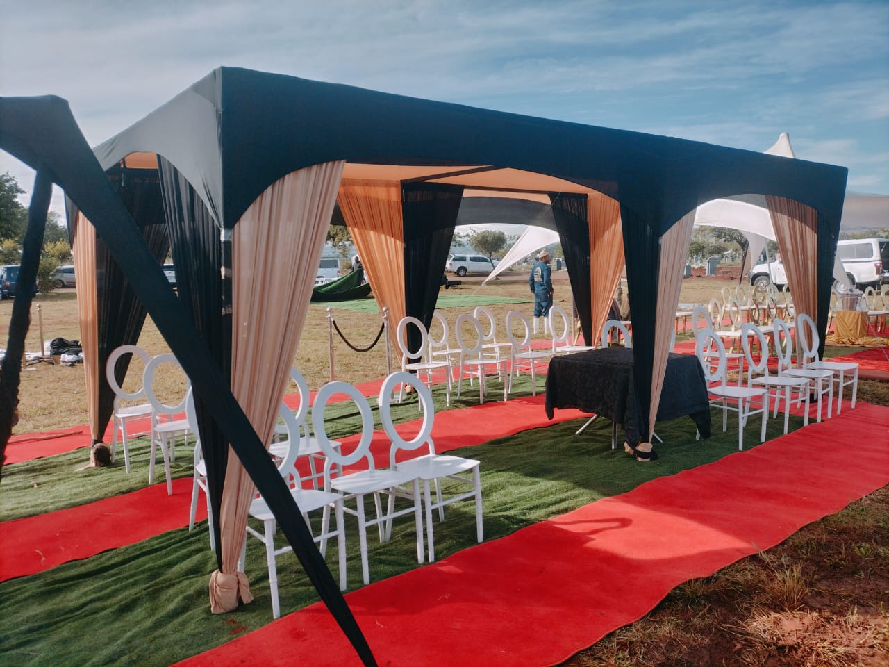 Black & orange draped tents